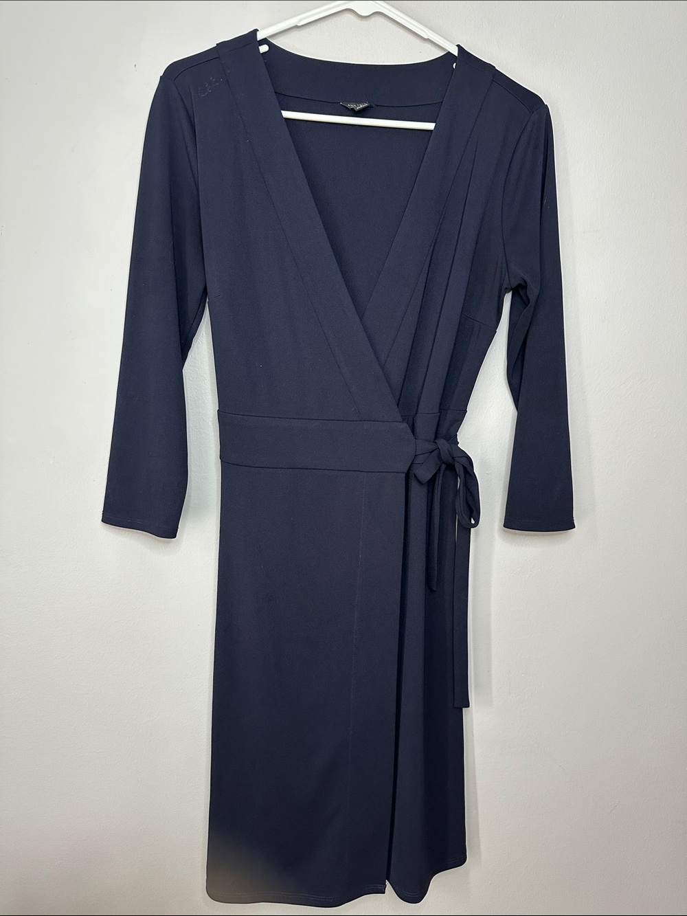 Ann Taylor black V-neck wrap dress with 3/4 sleeves and a waistband tie. Size 6